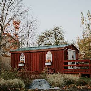 This bright red cabin with country charm will offer you a peaceful get away.
