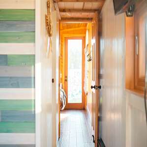 The hallway leading to the bathroom and second bed room.
