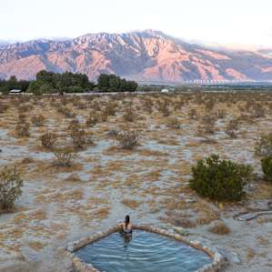 Enjoying the hot spring at sunrise.