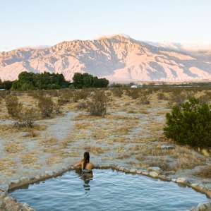 Enjoying the hot spring at sunrise.