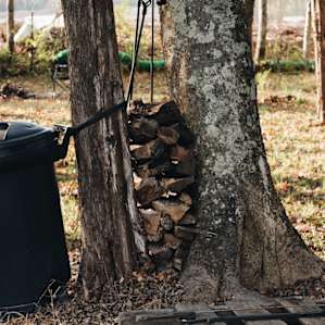 Trash can, cut firewood, and camp cooking tools ready for you!