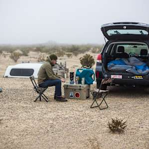 Our setup: sleeping bag and air mattress in the back of the car, plus a cooler as a makeshift table. There is also a picnic table on the other side of the campfire ring that makes a good spot for cooking and hanging out.