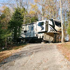 The larger RV site can accommodate larger RVs or travel trailers. From the top of the hill, you have great views of the lake.