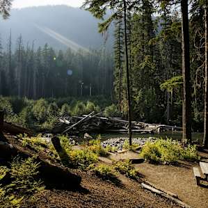 Day use area inside the campground on the river, accessible via a short trail down from the campsites