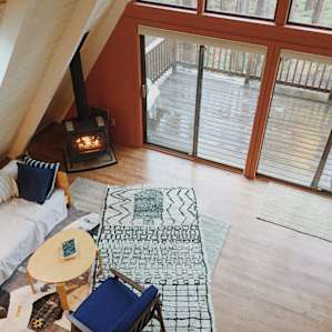 the beautifully decorated, cozy interior of the A-frame