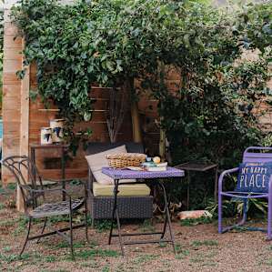 Cozy little sitting area under passion fruit.