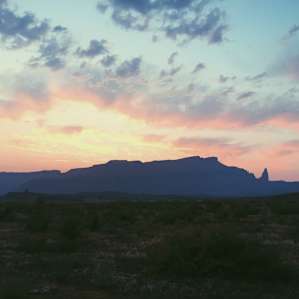 The view of the distant Fisher Towers during an early morning sunrise