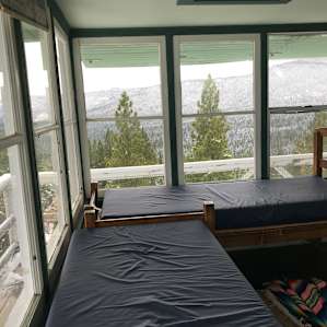 Two single beds, with 6 inch mattress topper (bring sheets or sleeping bags)