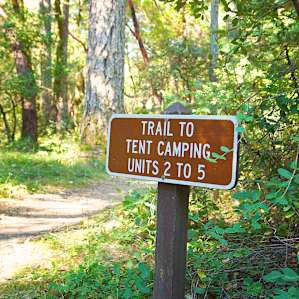 The sites are just beyond this sign. Easy walk, much more private than the sites in the middle of the campground.