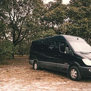 Our van parked along the trees