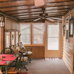 In the summers, the sun porch offers lots of natural light and the windows offer the sound of the creek flowing by across the street.