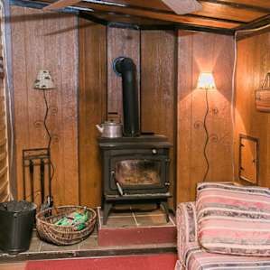 In the cooler months, a wood burning stove allows you sit warmly by a fire as you and your friends and family catch up and enjoy quiet and peaceful ambiance of the cabin.