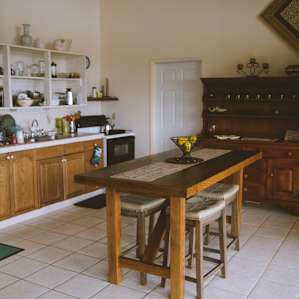 The kitchen is available for guest use, equipped with cookware, dishwater and a dining room table