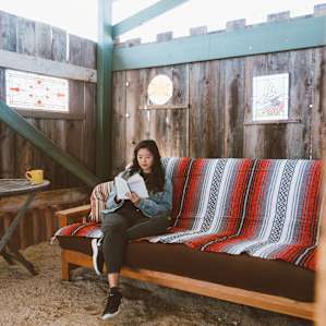 In addition to the trailer, there's a futon outside great for lounging or for hosting another camper.