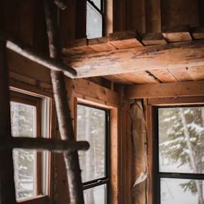 The hut has two cozy lofts that you can sleep in and lots of huge windows.