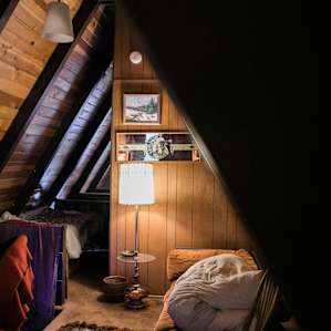 upstairs has a queen bed, twin bed, and couch