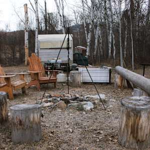 Fire pit with outdoor cooking setup.