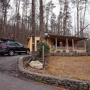 Outside view of the cabin and parking area.