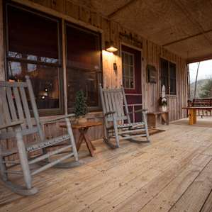 The front porch overlooks peaceful farm pastures - a perfect spot for relaxing.