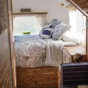 The bed in the back of the airstream, very cozy and cute!