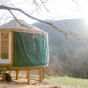 The yurt's front windows face the mountains, a perfect setup for watching sunrise.