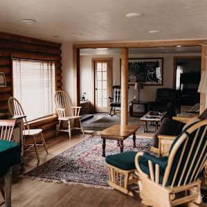 Two living rooms. This first living room has a hide-a-bed.