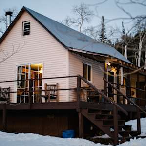 The view of the cabin right off the driveway. Be sure to bring a snow-capable vehicle in the winter!