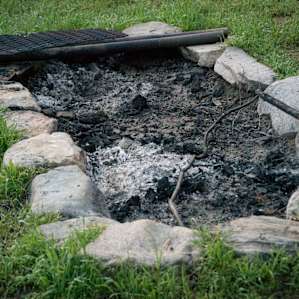 The huge fire pit next to the communal kitchen area