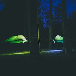 Tree tents in the night have lights inside!