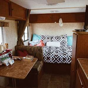 kitchen dinette and full-sized bed