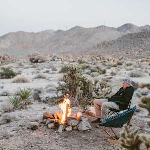 people mountain campfire