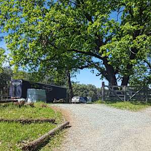 The driveway is to the left