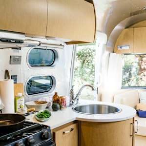 The stove, oven, sink, and refrigerator make camp cooking easy!