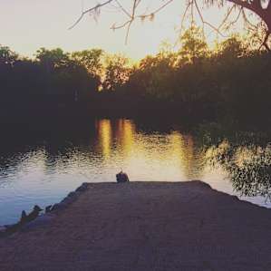 My daughter chilling on the boat ramp