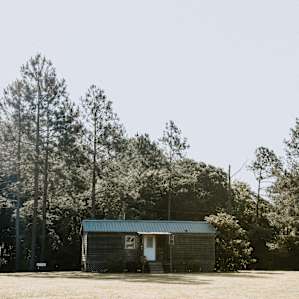 The setting for the Country Cabin is absolutely perfect. Check out the pine trees back there!