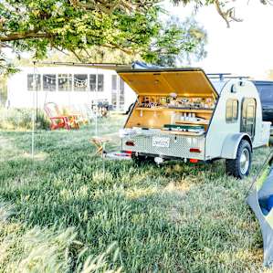 The campsite sits next to the hosts' garden and bus.