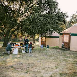 Getthing things prepped for dinner. There a picnic tables near the yurts that you can use.