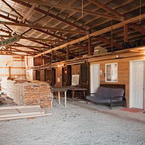 Inside the green barn. Rooms are in a row along the back of the barn as well as showers and the bathroom.