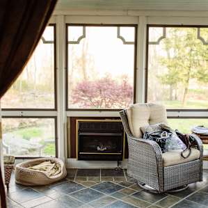 The sunroom is a beautiful place to relax right at the front of the house.