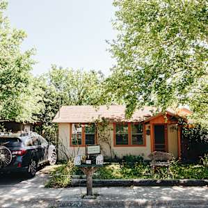 Front view of the cottage with driveway parking