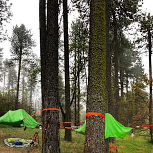 Our tree tents with colorful lounging pads with pillows underneath