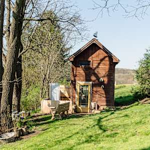 Exterior of the cabin and outdoor shower.