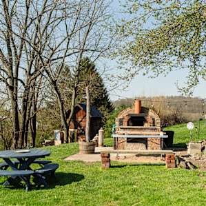 This is the beautiful patio area available for use with a wood-burning pizza oven (you have the option of adding on farm-fresh meals to your stay!)!