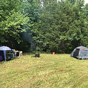 Campsite 2 is in a perfect clearing in the woods! Private & quiet. The fire pit was excellent for grilling!
