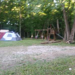 Close to the tents and cooking! Gave that swing set a good workout!