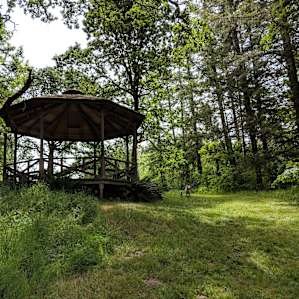 The gazebo on the meadows. Forest to left and right. Picture taken from Campspot