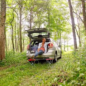 Taking a break from unloading - the path to the river site has just enough room for a car to come through which makes for an easy unload.