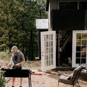 Outside stove with three burners for cooking.