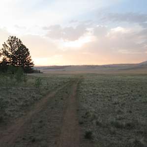 sunset over the huge adjacent valley. Campsite is in the trees on the left.