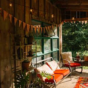 Bunting and fairy lights give the porch a magical feel.